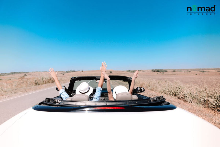 Two people on a cross-country road trip in a convertible.