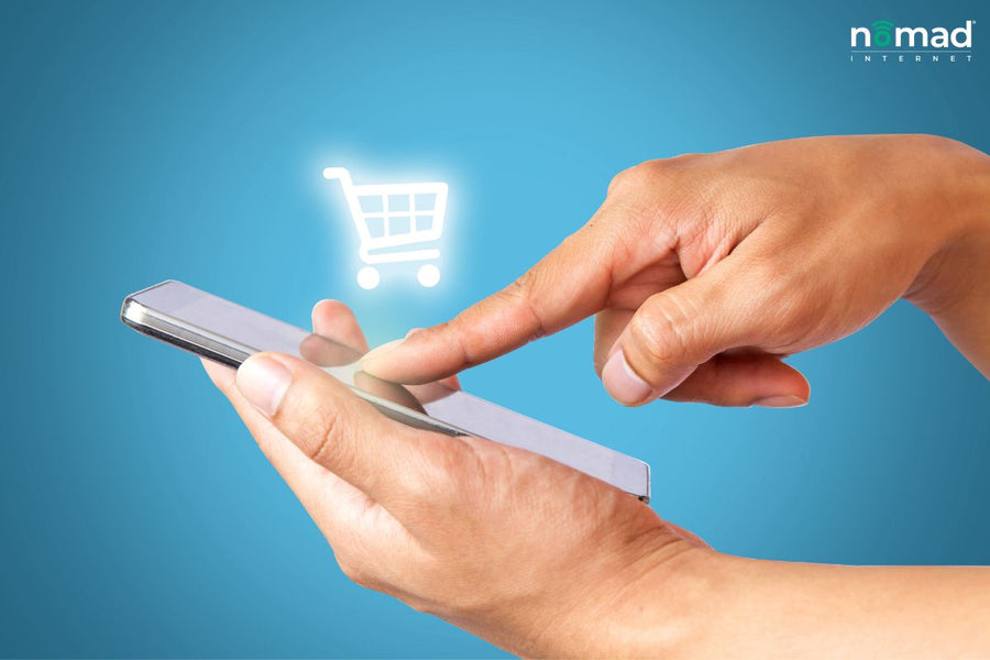 Rural Ecommerce: A finger tapping on a cellphone with a shopping trolley. 